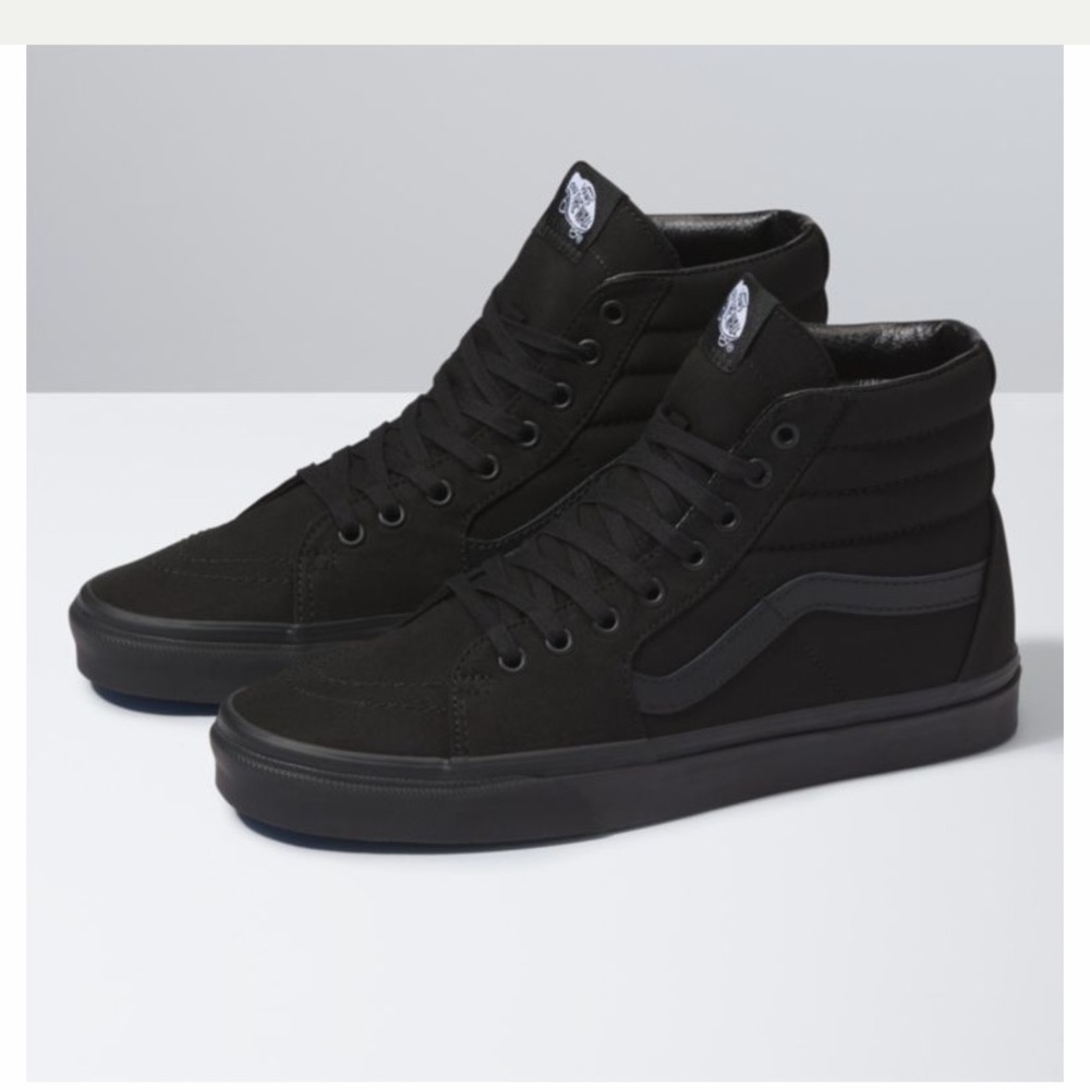 All black high top Vans